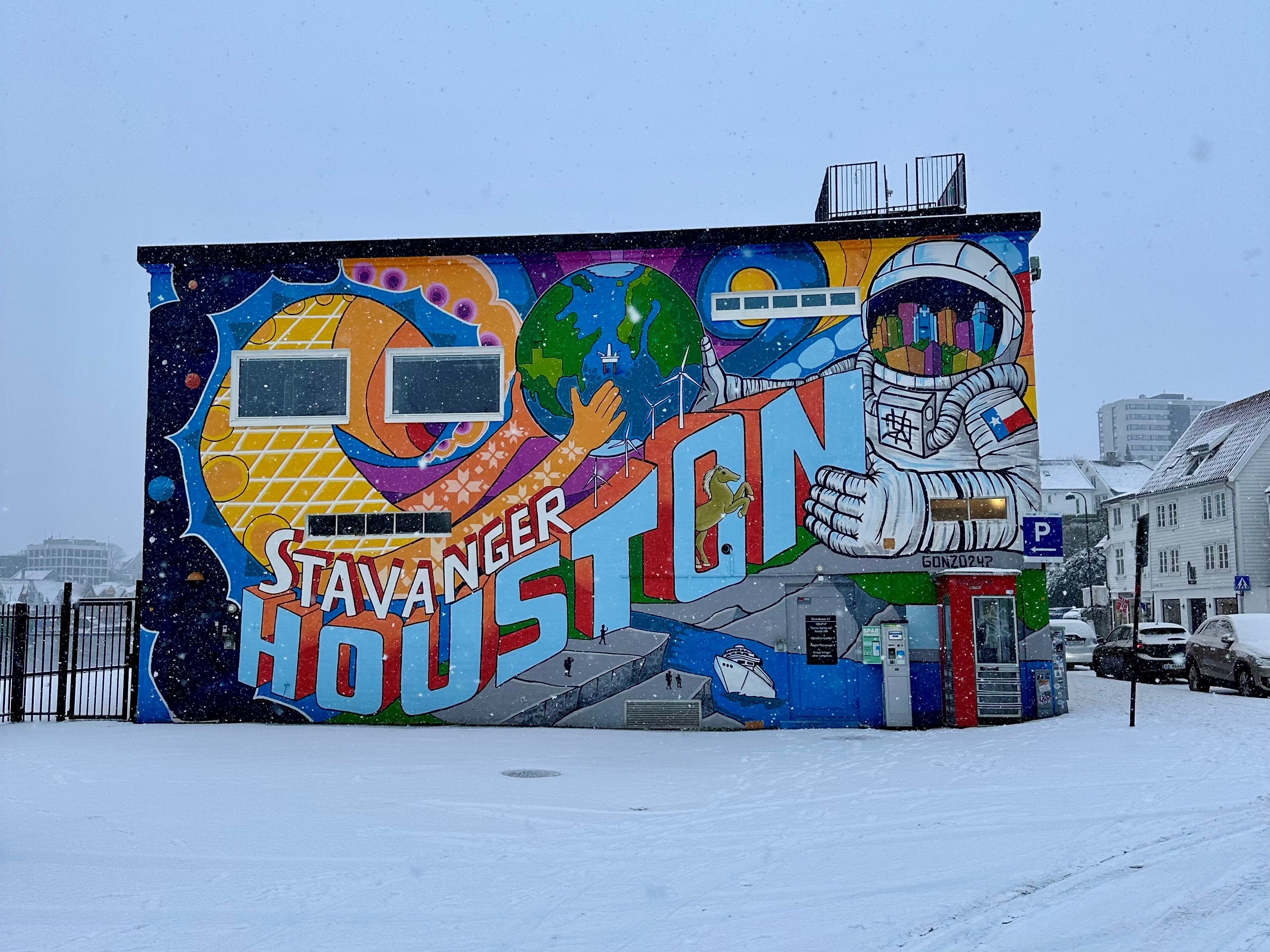 Street art in Stavanger depicting the city's connection with Houston, Texas. The street art shows a variety of themes including space travel, oil and shipping