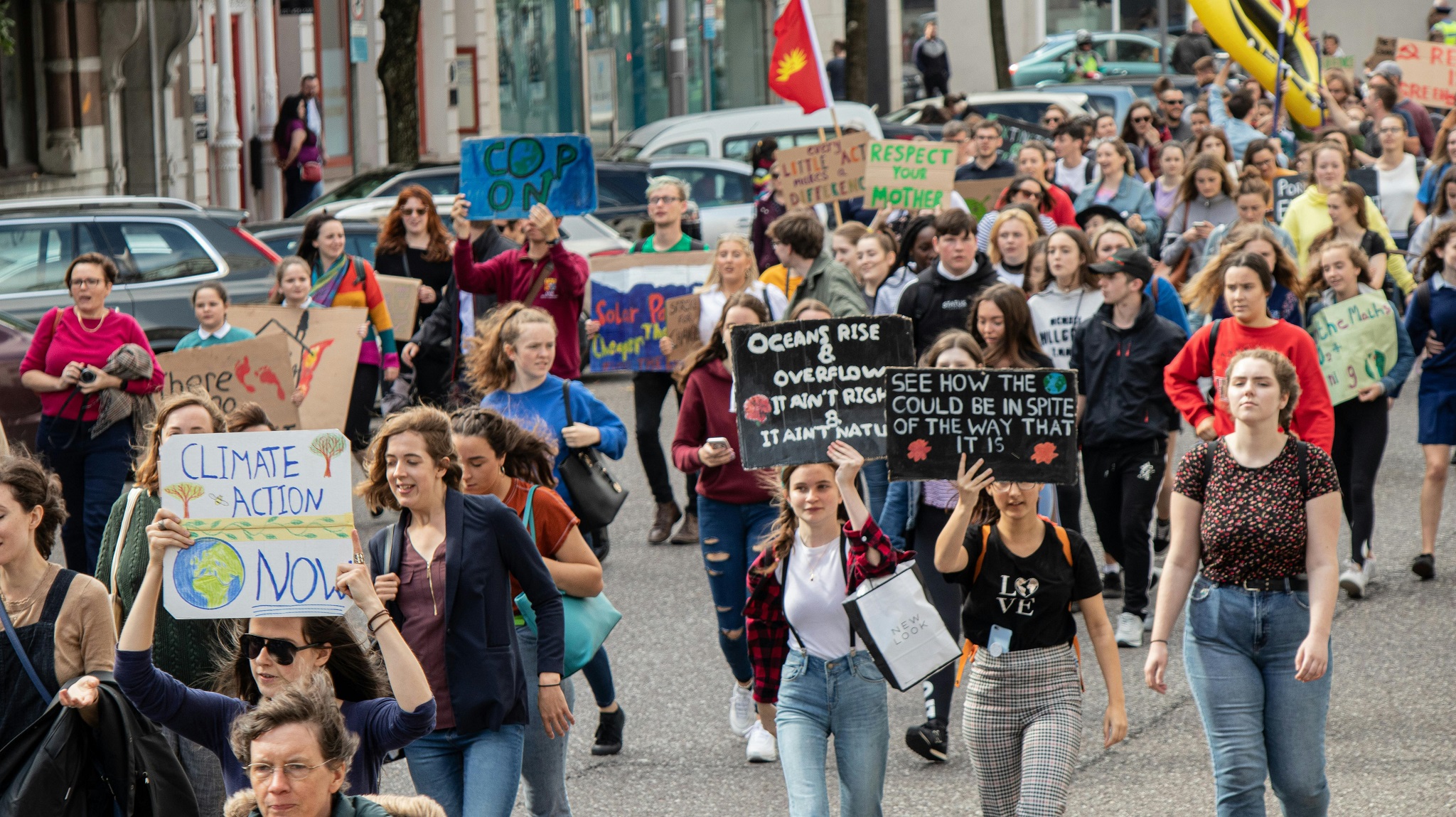 A crowd of people marching in a rally