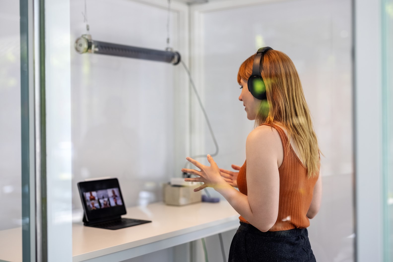 Woman presenting in front of a screen.