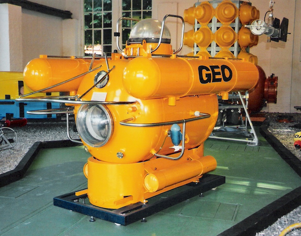 A yellow submersible vehicle in its dock