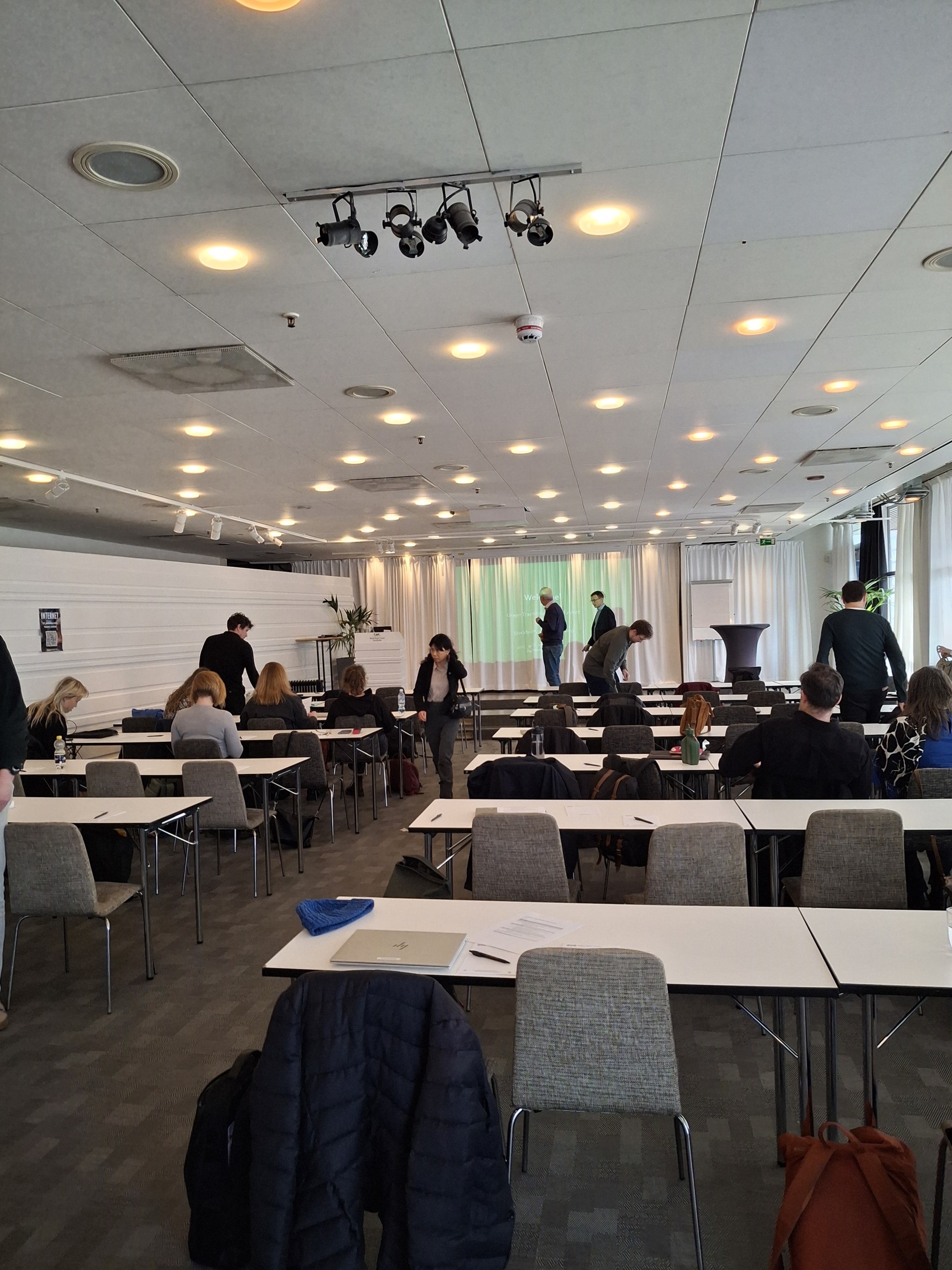 A conference room with tables set out in rows