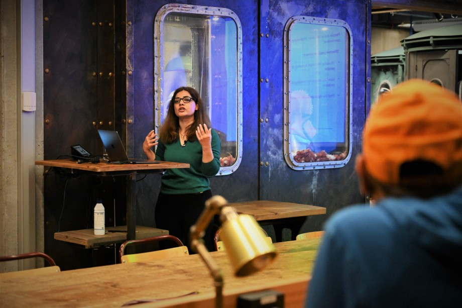 Woman teaching in an industrial-looking learning environment